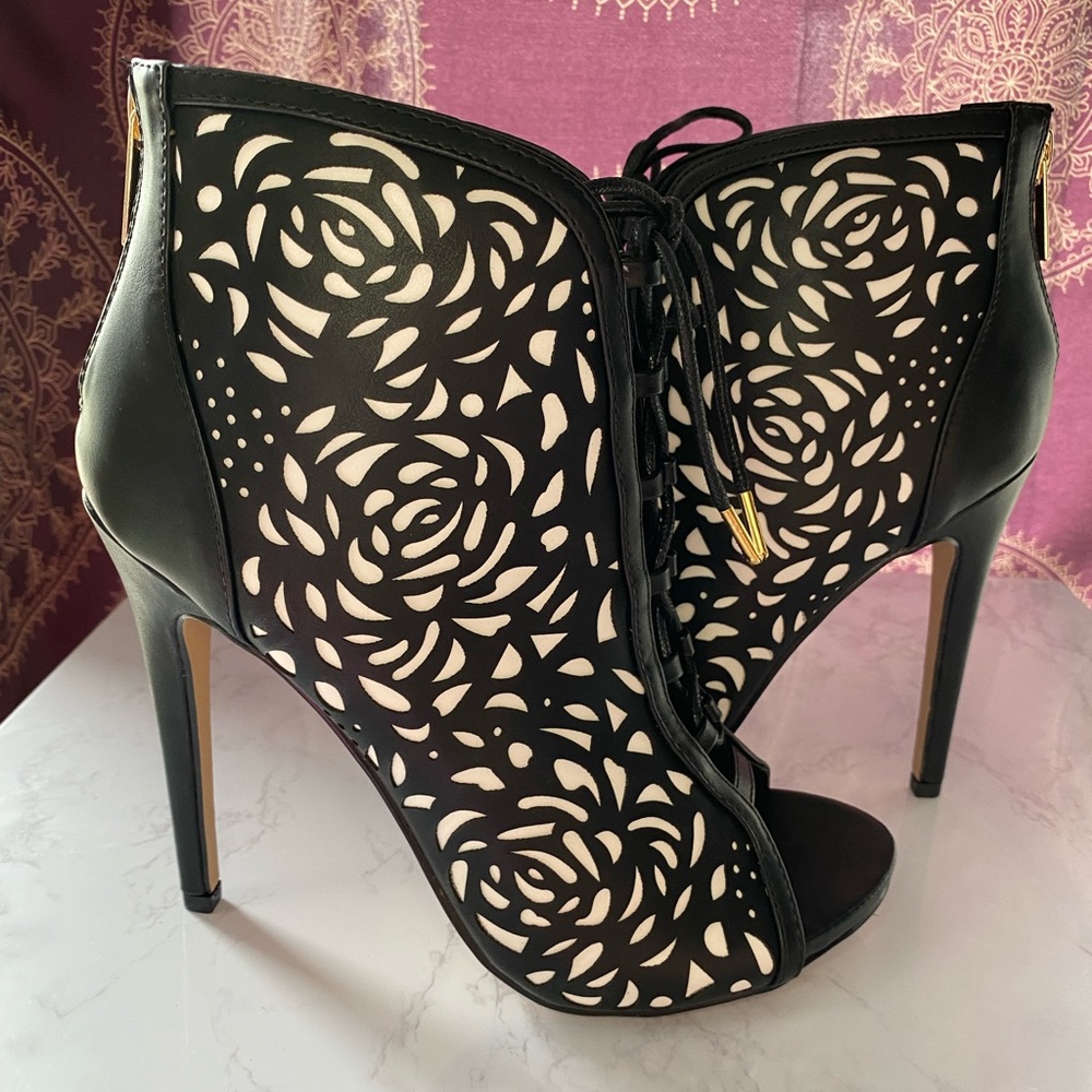 Floral cutout lace up stiletto boots